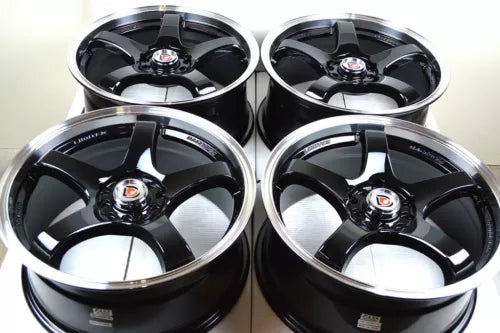 Set of four black alloy wheel rims with silver spokes and center cap