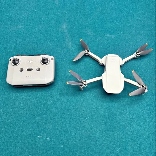 DJI Mini 2 SE drone with white quadcopter and remote controller