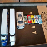 8 diecast toy cars set with assorted colors on display board
