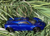 Blue diecast metal car ornament with silver loop, 1:64 scale