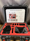 Hard shell drone case with red interior foam and instruction card inside