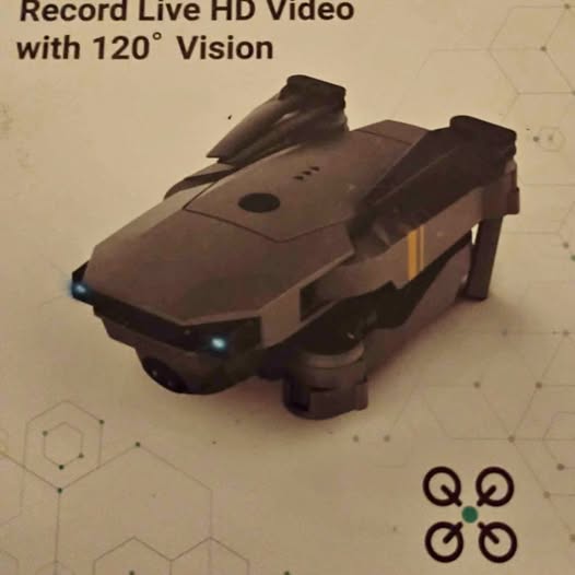 Camera drone with four propellers, dark body and front camera lens
