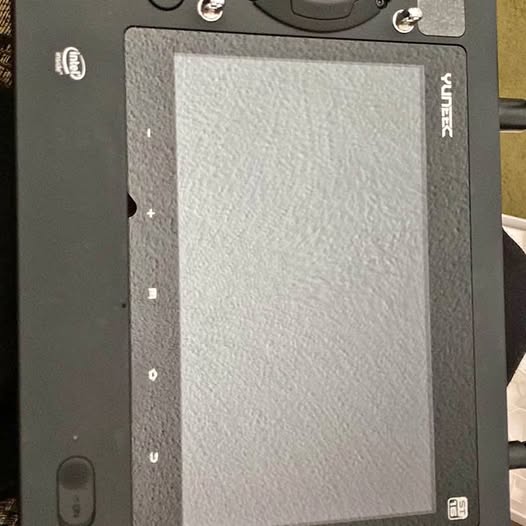 Drone controller with large rectangular touchscreen and side button controls