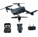 Foldable quadcopter drone with built-in camera, shown with remote and small display