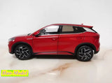 Red 1:18 diecast SUV model car with black alloy wheels, side profile
