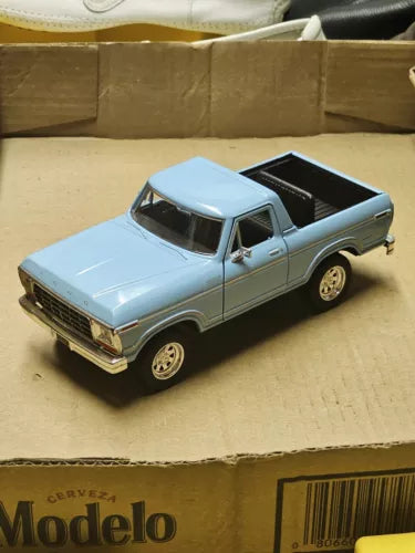 Light blue 1978 Ford Bronco diecast toy truck, front three-quarter view