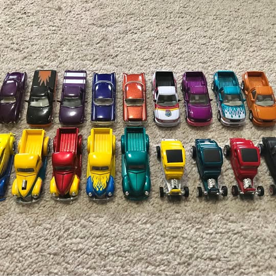 Set of die-cast model cars in mixed colors, front views
