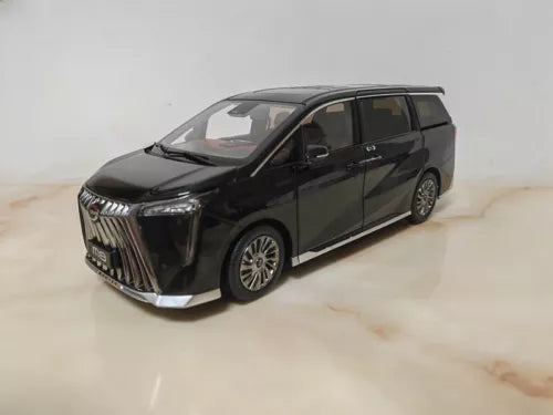 Black 1/18 diecast minivan model with chrome grille and front 3/4 view