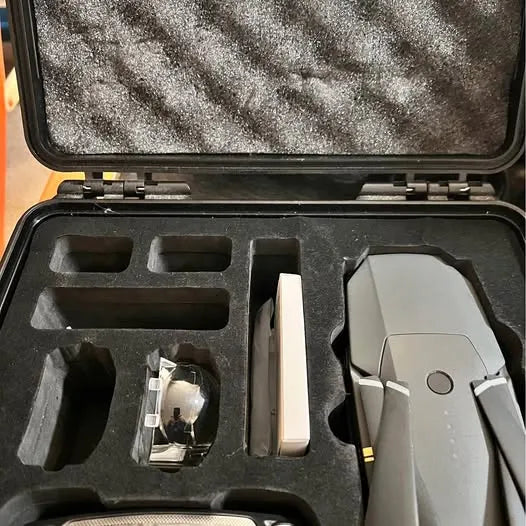 DJI Mavic Pro drone in hard carry case with foam inserts and accessories
