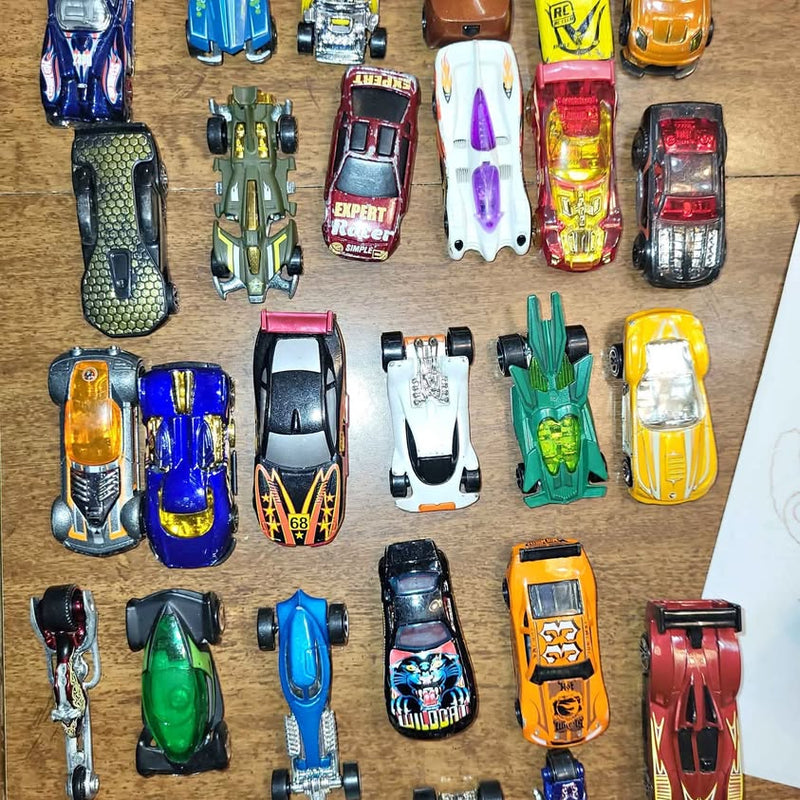 Assorted diecast cars in multiple colors, including blue, green, orange, and red models