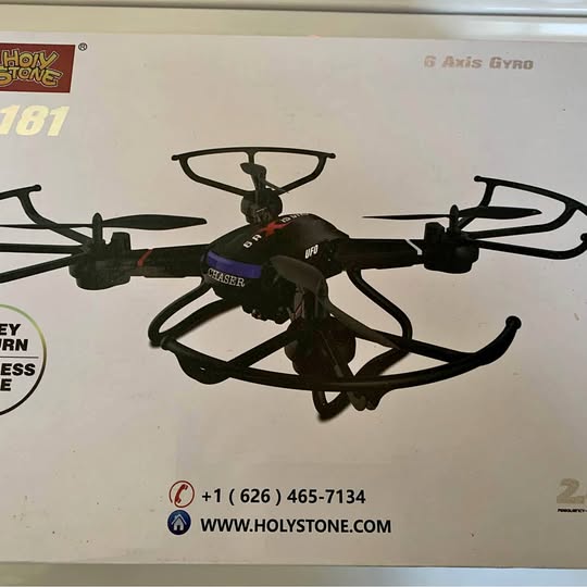 Black quadcopter drone with four propellers