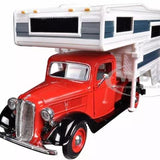 Red diecast pickup truck with chrome grille and mounted camper shell, front 3/4 view