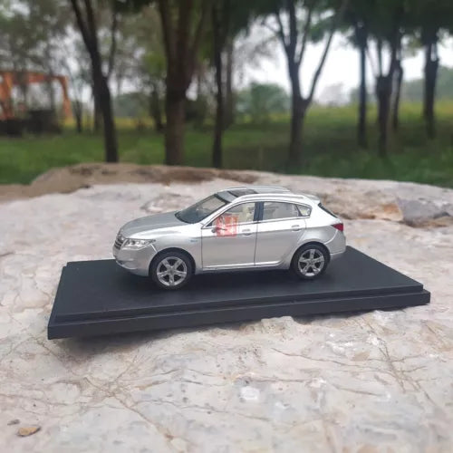 1/43 scale diecast model car, silver sedan on black display base