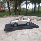 1/43 scale diecast model car, silver sedan on black display base