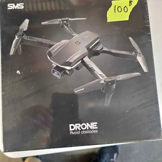 Gray quadcopter drone with four propellers and foldable arms