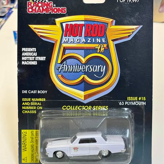 White 1/64 diecast model car in blister pack, Plymouth styling