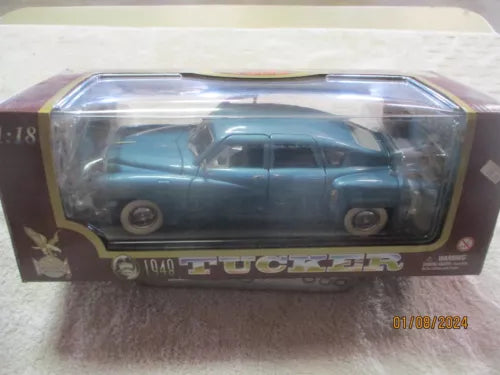 Blue 1:18 diecast Tucker Torpedo car model in display case