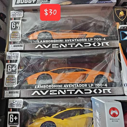 Toy drone retail box with orange vehicle graphics