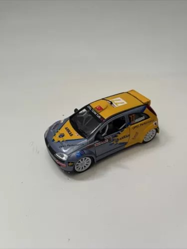 Saica 1/32 Opel Corsa diecast model car, yellow body with dark hood and silver wheels