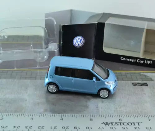 Blue 1/64 scale diecast Volkswagen Concept Car UP model with VW logo