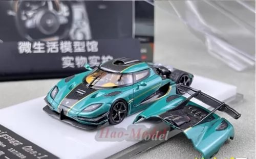 Alloy diecast car model in turquoise with black details and dark wheels
