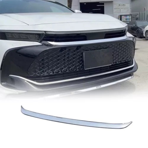 White diecast taxi car front grille with chrome bumper trim, close-up