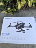 Foldable GPS drone packaging with dark gray quadcopter illustration