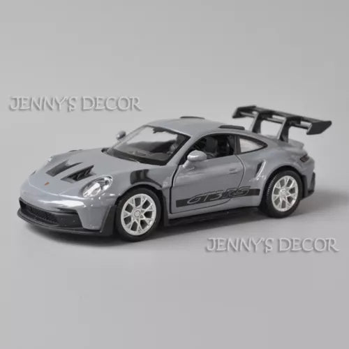 1:36 scale diecast Porsche GT3 RS model car in silver with rear wing and decals