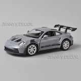 1:36 scale diecast Porsche GT3 RS model car in silver with rear wing and decals