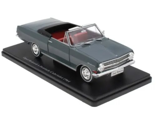 Dark green 1964 cabriolet diecast model car with open-top seats on display base