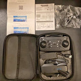 Foldable mini drone kit with controller in zippered carry case