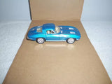 Blue pullback diecast car toy with white wheels, in open box, front 3/4 view