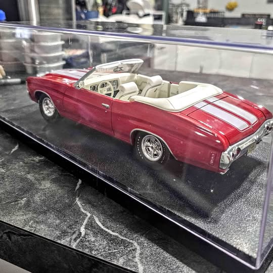 Red and white striped convertible diecast model car with chrome wheels