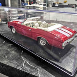 Red and white striped convertible diecast model car with chrome wheels