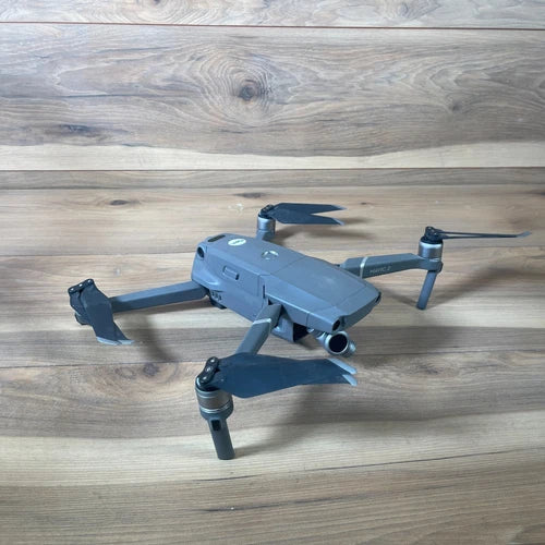 Gray quadcopter drone with 3-axis gimbal and 4 propellers