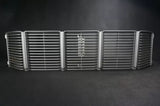 1/18 diecast car front grille in silver with center emblem and twin headlight bays