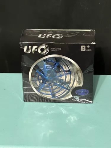 Interactive UFO aircraft drone in retail box, blue propeller design, for ages 8+