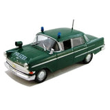 Green Opel Kapitan police diecast model car, front 3/4 view, windshield lights