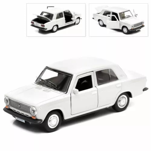 White diecast model car, classic four-door sedan, front three-quarter view