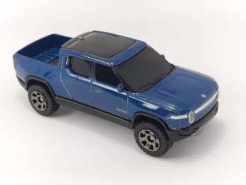 Blue diecast pickup truck model with black roof and hood, detailed wheels