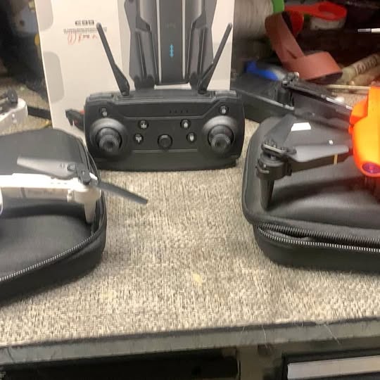 Black drone remote controller with two antennas and joysticks