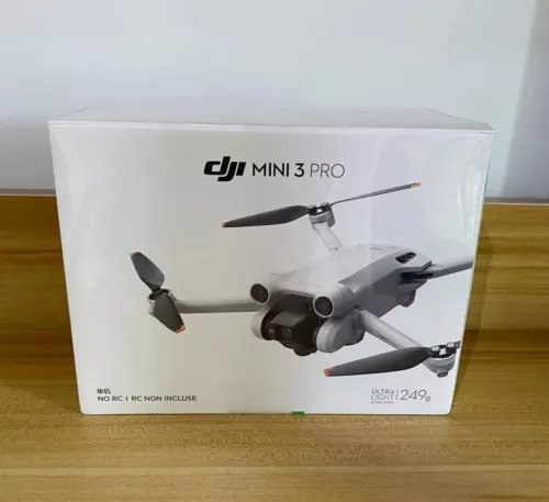 DJI Mini 3 Pro camera drone in retail box, gray quadcopter with four propellers