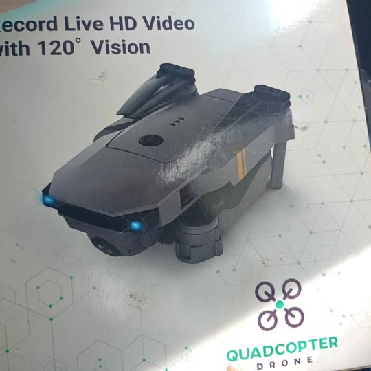 Gray quadcopter drone with blue lights, compact body and four propellers
