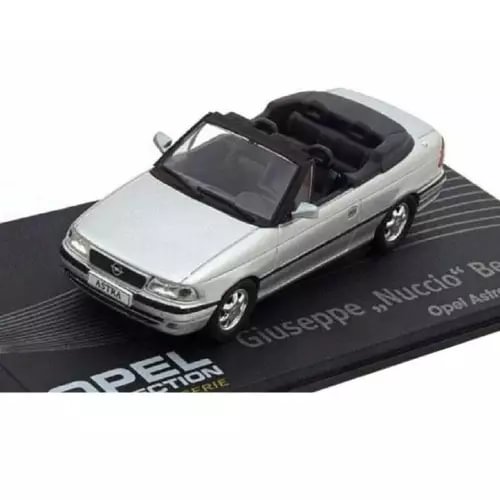 Diecast cabriolet model car with white body and black convertible top on display base