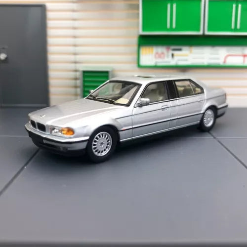Silver 1/64 BMW 7 Series E38 diecast sedan model car, front 3/4 view