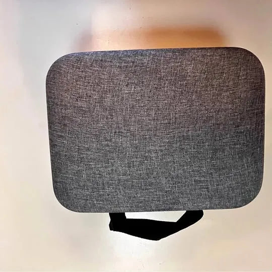 Textured gray drone camera cover panel with a small black opening
