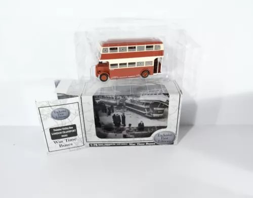 Diecast model bus in retail box, red and cream livery.