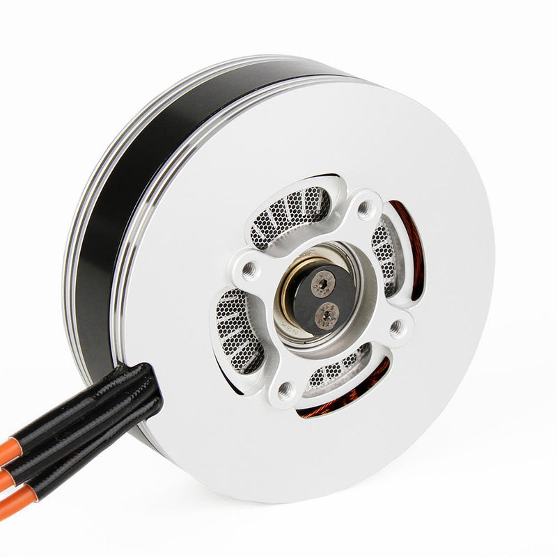 Drone servo motor with circular white housing and exposed connectors