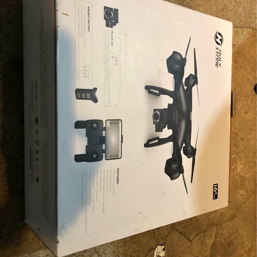 Drone product box with printed quadcopter and remote controller