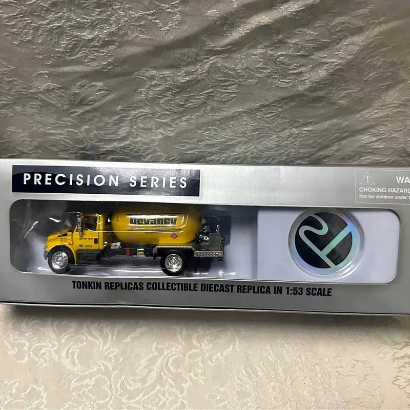 Yellow and black diecast propane truck collectible in clear retail box